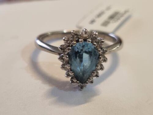 18ct white gold ring featuring a 1.90 carat pear-shaped topaz and 0.40 carat diamonds with elegant setting and intricate design.