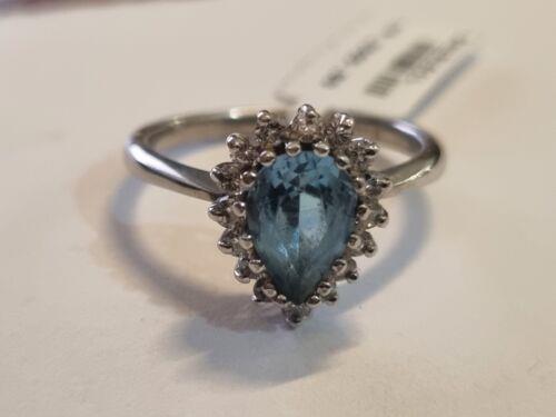 18ct white gold ring with a 1.90 carat pear-shaped topaz and 0.40 carat diamond accent, showcasing elegant jewelry design.
