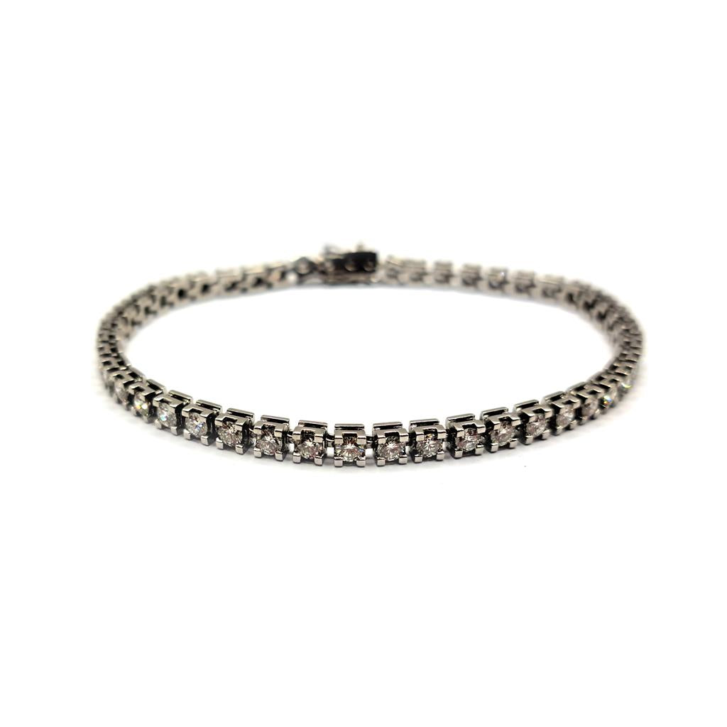 Elegant 18ct white gold diamond bracelet with 3.76 carats of G color, VS2 clarity diamonds, showcasing fine craftsmanship.