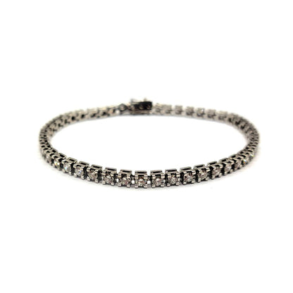 Elegant 18ct white gold diamond bracelet with 3.76 carats of G color, VS2 clarity diamonds, showcasing fine craftsmanship.