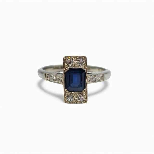 18ct white gold and platinum diamond and sapphire ring showing sparkling gemstones and intricate band design.