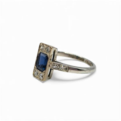 18ct white gold and platinum diamond and sapphire ring, featuring sparkling gemstones and intricate band design.