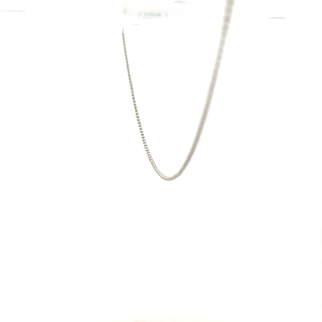 18ct white gold chain weighing 2.5g, featuring a delicate link design, displayed against a plain background.