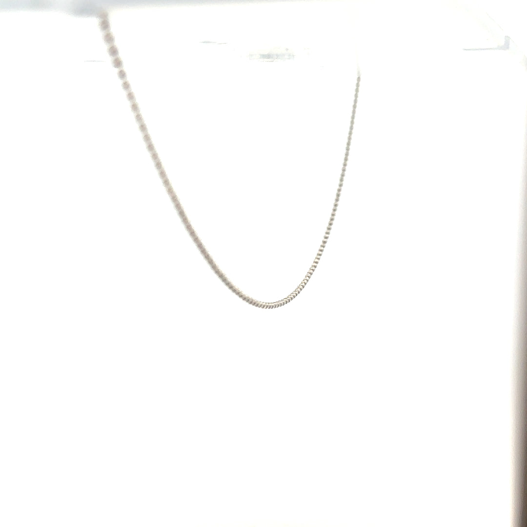 18ct white gold chain weighing 2.5g, featuring a delicate link design, displayed on a plain background.