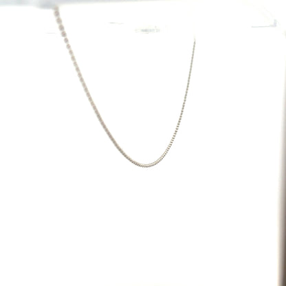 18ct white gold chain weighing 2.5g, featuring a delicate link design, displayed on a plain background.