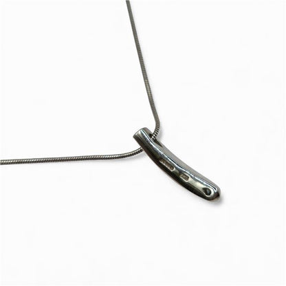 18ct white gold chain with diamond pendant, showcasing a sparkling diamond set in a delicate gold setting.