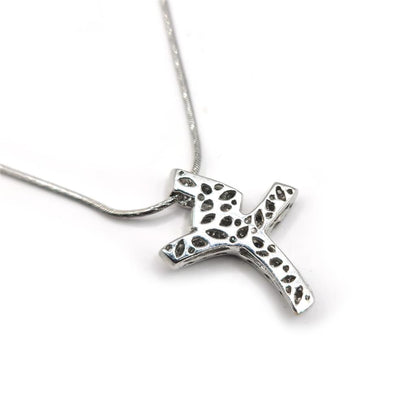 18ct white gold chain with a 0.65 carat diamond twist cross pendant, showcasing elegant jewelry craftsmanship.