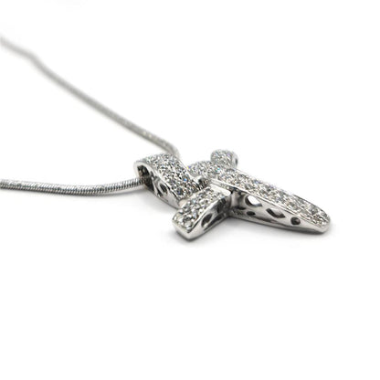 18ct white gold chain with a 0.65 carat diamond twist design cross pendant, showcasing elegant jewelry craftsmanship.