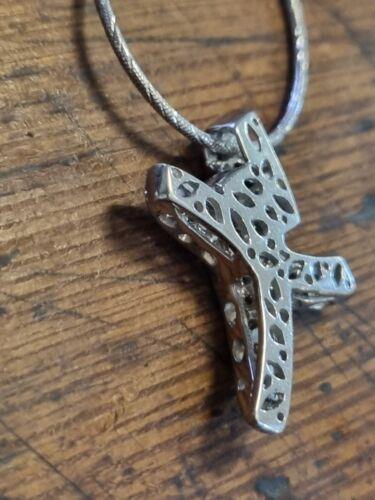 18ct white gold chain with 0.65 carat diamond twist design cross, showcasing elegant jewelry craftsmanship.