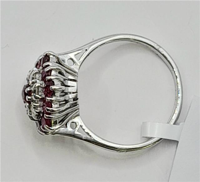 18ct white gold diamond and ruby ring with sparkling diamonds and vibrant rubies, elegant jewelry centerpiece.