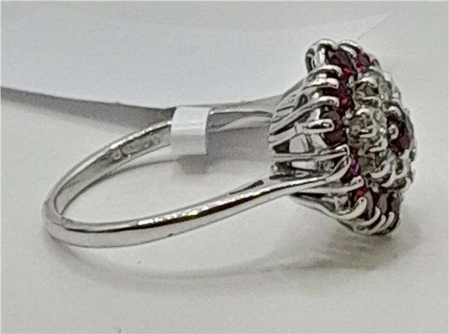 18ct white gold diamond and ruby ring with sparkling stones and elegant design, showcasing the luxurious jewelry piece.