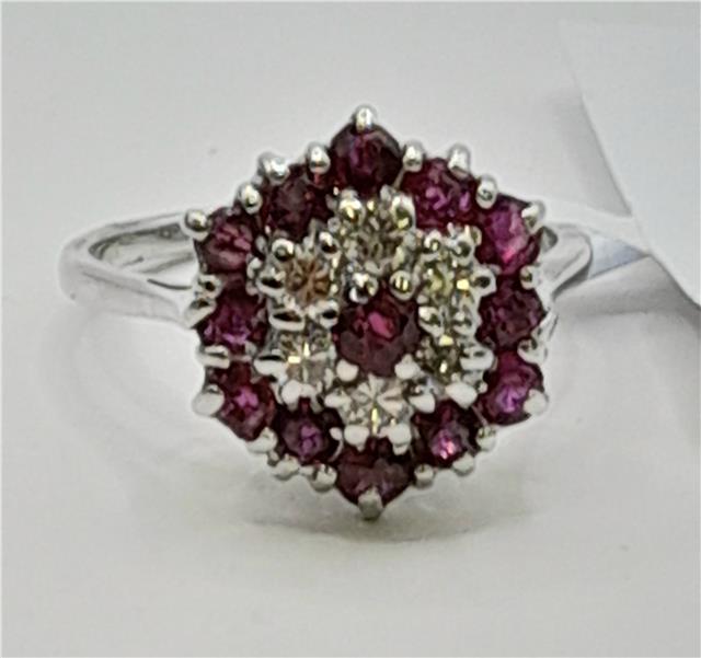 18ct white gold ring featuring diamonds and rubies, showcasing elegant gemstone detailing and fine jewelry craftsmanship.