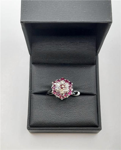 18ct white gold diamond and ruby ring featuring sparkling diamonds and vibrant rubies, elegant jewelry piece.
