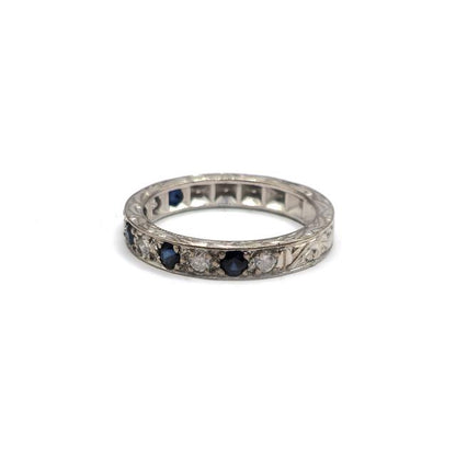 18ct white gold diamond and sapphire half eternity ring with alternating stones, elegant jewelry design.