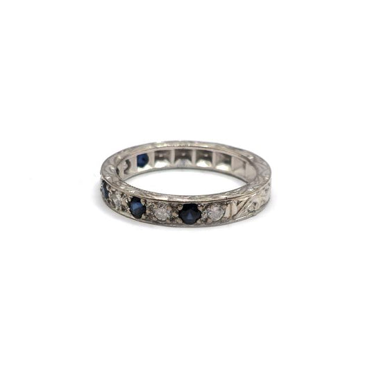 18ct white gold diamond and sapphire half eternity ring with alternating stones, elegant jewelry design.