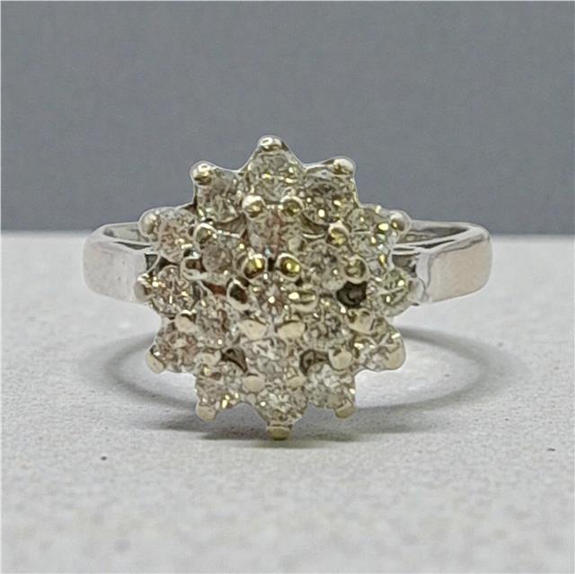 18ct white gold diamond cluster ring in size L, featuring a sparkling diamond design and intricate setting.