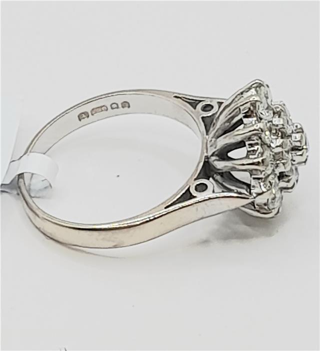 18ct white gold diamond cluster ring in size L with sparkling diamonds, showcasing an elegant and sophisticated jewelry design.