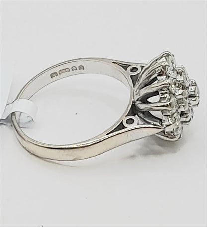 18ct white gold diamond cluster ring in size L with sparkling diamonds, showcasing an elegant and sophisticated jewelry design.