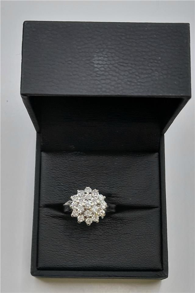 18ct white gold diamond cluster ring in size L, featuring a sparkling diamond design and elegant craftsmanship.