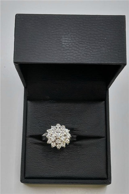 18ct white gold diamond cluster ring in size L, featuring a sparkling diamond design and elegant craftsmanship.