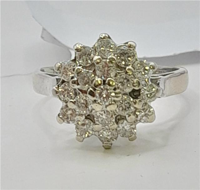 18ct white gold diamond cluster ring in size L, featuring a sparkling diamond design and elegant craftsmanship.