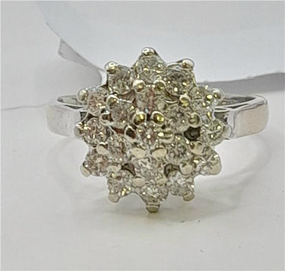 18ct white gold diamond cluster ring in size L, featuring a sparkling diamond design and elegant craftsmanship.