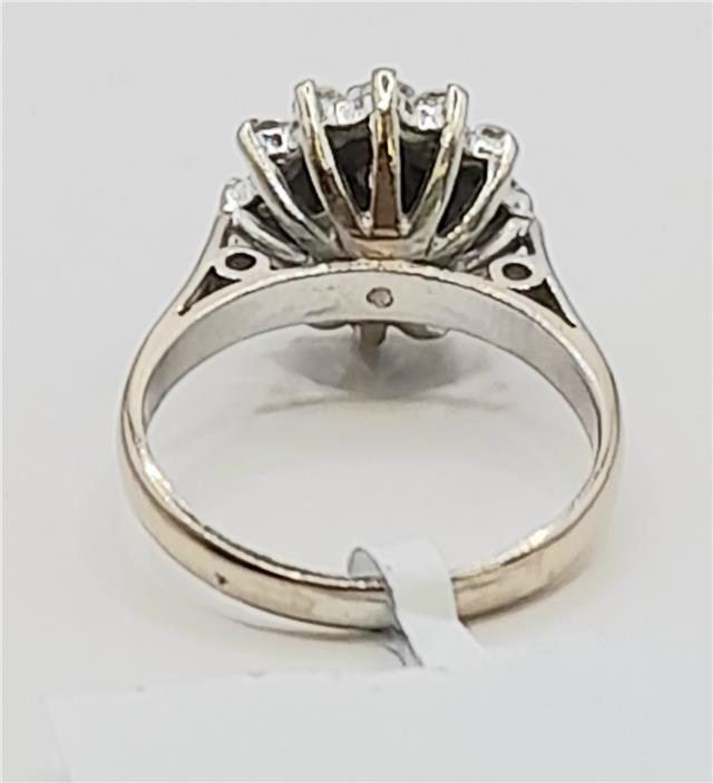 18ct white gold diamond cluster ring in size L featuring a sparkling diamond design, unbranded jewelry piece.
