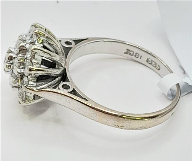 18ct white gold diamond cluster ring in size L, featuring a sparkling diamond design and intricate craftsmanship.