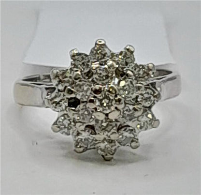 18ct white gold diamond cluster ring in size L, featuring a sparkling diamond design and elegant craftsmanship.