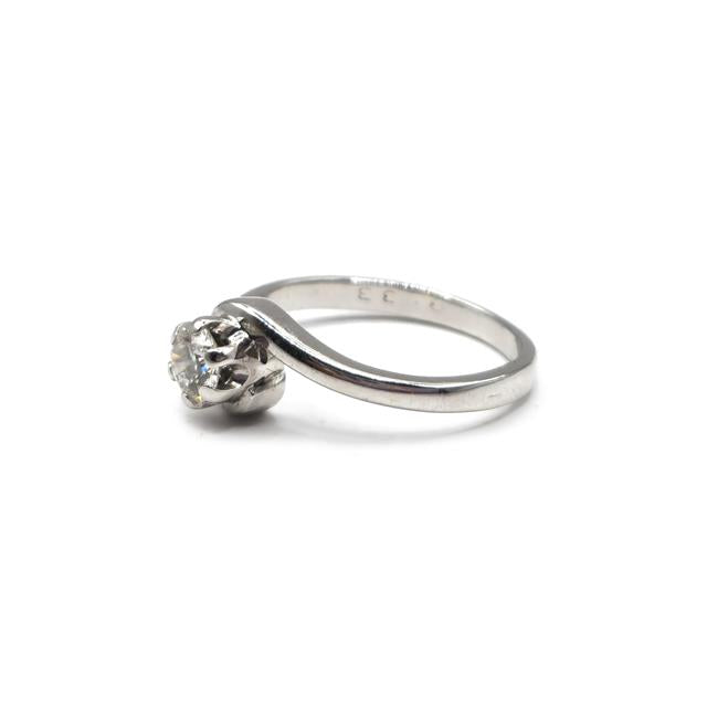 18ct white gold diamond ring with a sleek band and sparkling diamonds, showcasing elegant jewelry design.