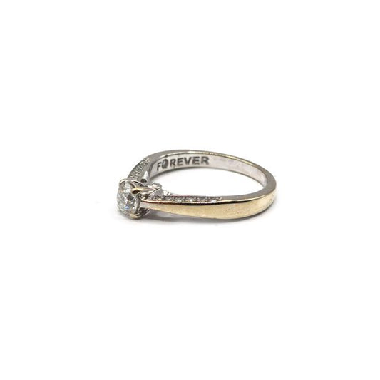 18ct white gold diamond ring with sparkling diamonds, featured in a close-up shot showcasing the elegant design and craftsmanship.
