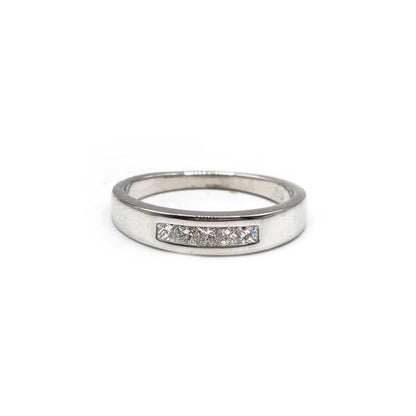 18ct white gold diamond ring with a central diamond and elegant band, showcasing fine craftsmanship.