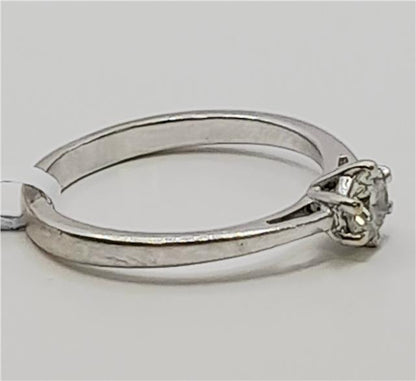 18ct white gold diamond ring in size I 1/2 featuring a sparkling diamond centerpiece and a sleek band design.