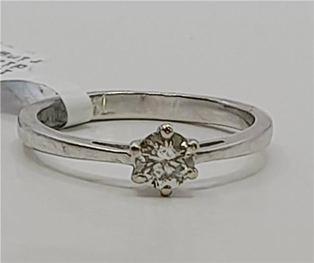 18ct white gold diamond ring in size I 1/2 with sparkling diamonds and a sleek band design.