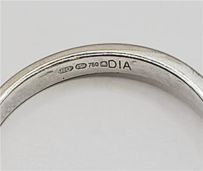 18ct white gold diamond ring in size I 1/2 featuring sparkling diamonds and a sleek band design.