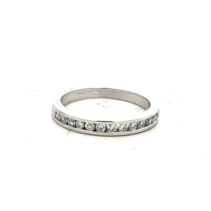 18ct white gold diamond ring with a central diamond, size J, featuring elegant craftsmanship and sparkling gemstones.