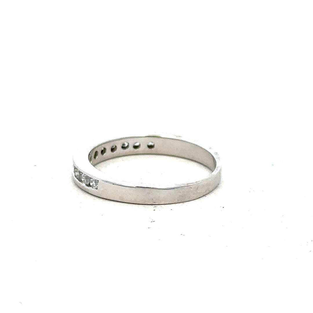 18ct white gold diamond ring in size J with sparkling diamonds, showcasing elegant craftsmanship and a polished finish.