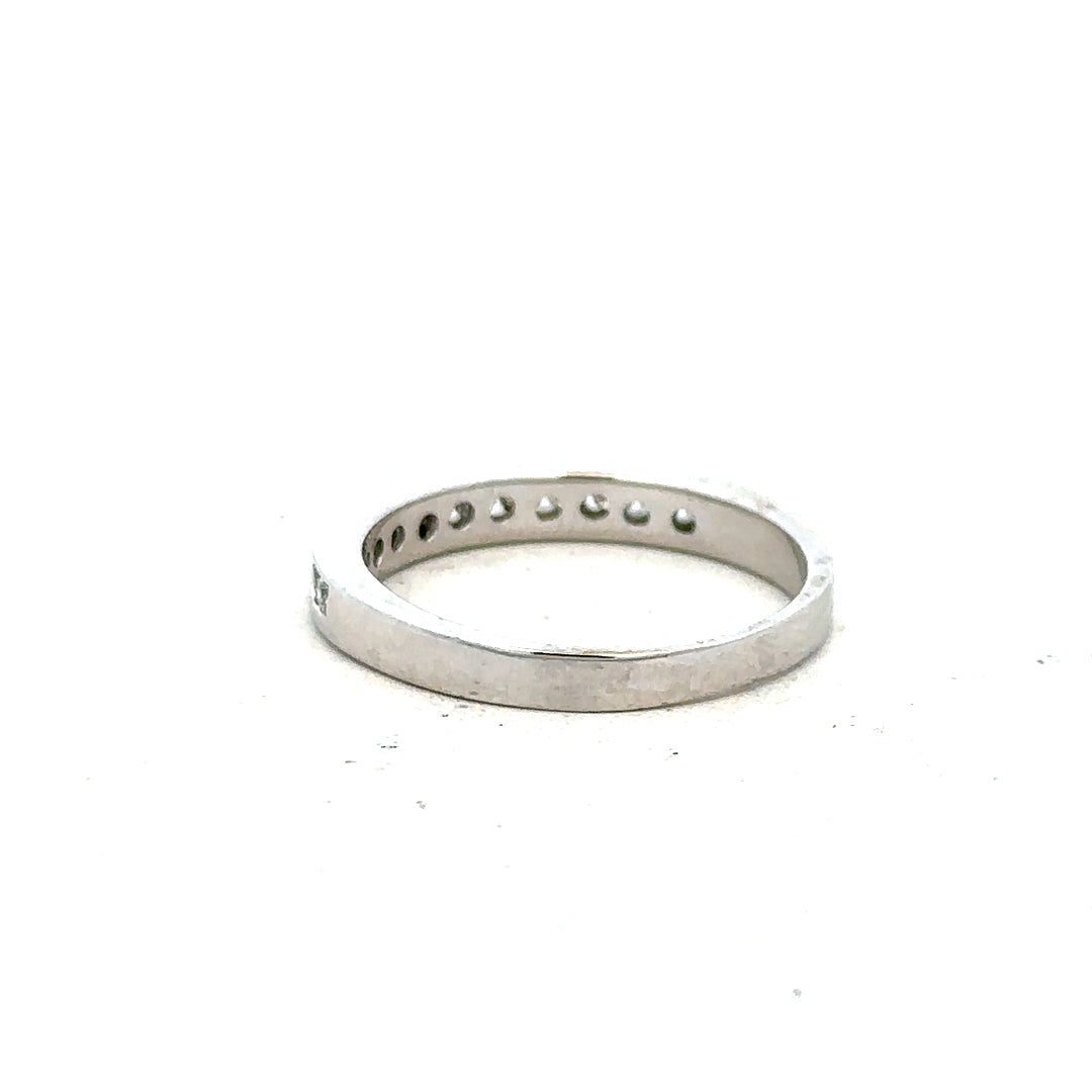 18ct white gold diamond ring in size J with sparkling diamonds, showcasing elegant craftsmanship and a sleek band design.