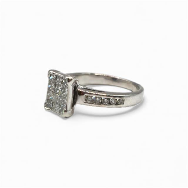 18ct white gold diamond ring in size J1/2 featuring a sparkling central diamond and elegant band design.