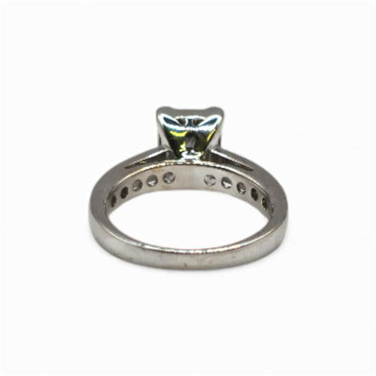 18ct white gold diamond ring in size J1/2 featuring a sparkling diamond, elegant jewelry piece with a sleek band design.