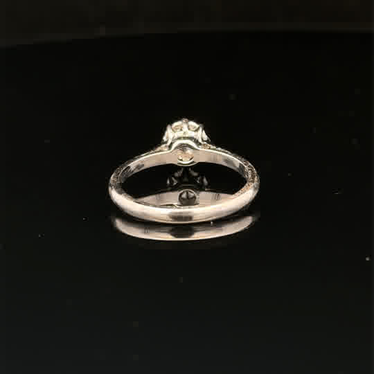 18ct white gold diamond ring in size K with sparkling diamonds, showcased on a plain background.
