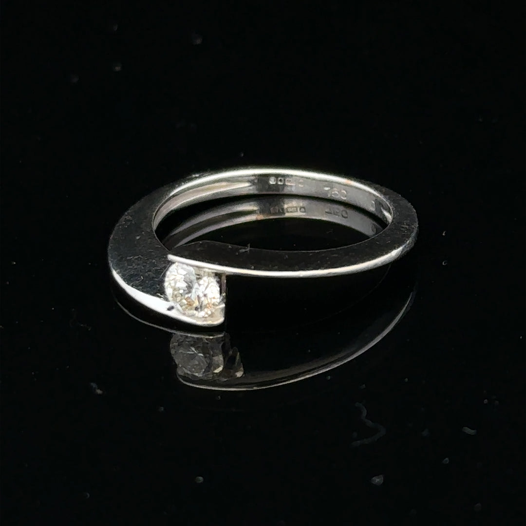 18ct white gold diamond ring in size K1/2 with sparkling diamonds, elegant jewelry piece with a sleek band design.