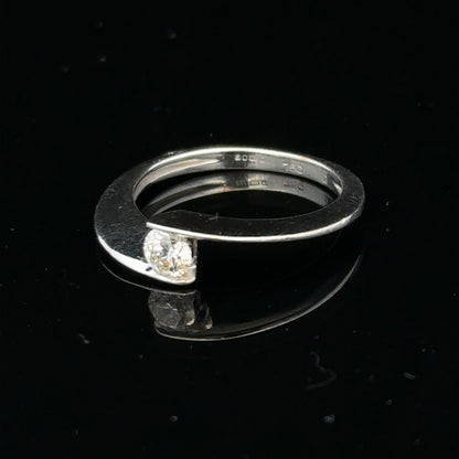 18ct white gold diamond ring in size K1/2 with sparkling diamonds, elegant jewelry piece with a sleek band design.