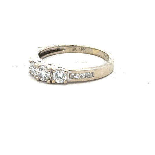 18ct white gold diamond ring, size L, featuring sparkling diamonds on a sleek band.