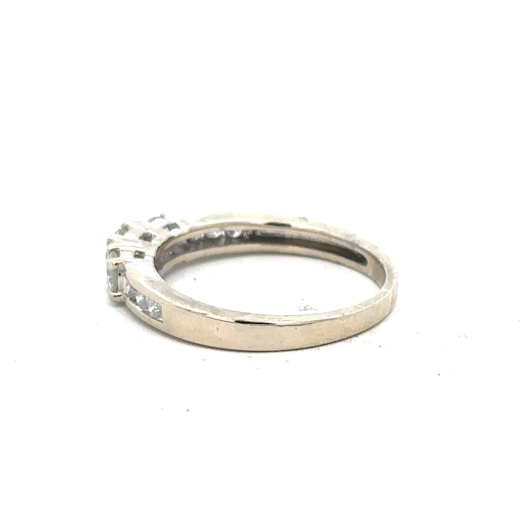18ct white gold diamond ring in size L with sparkling diamonds, showcasing elegant craftsmanship and a sleek band.
