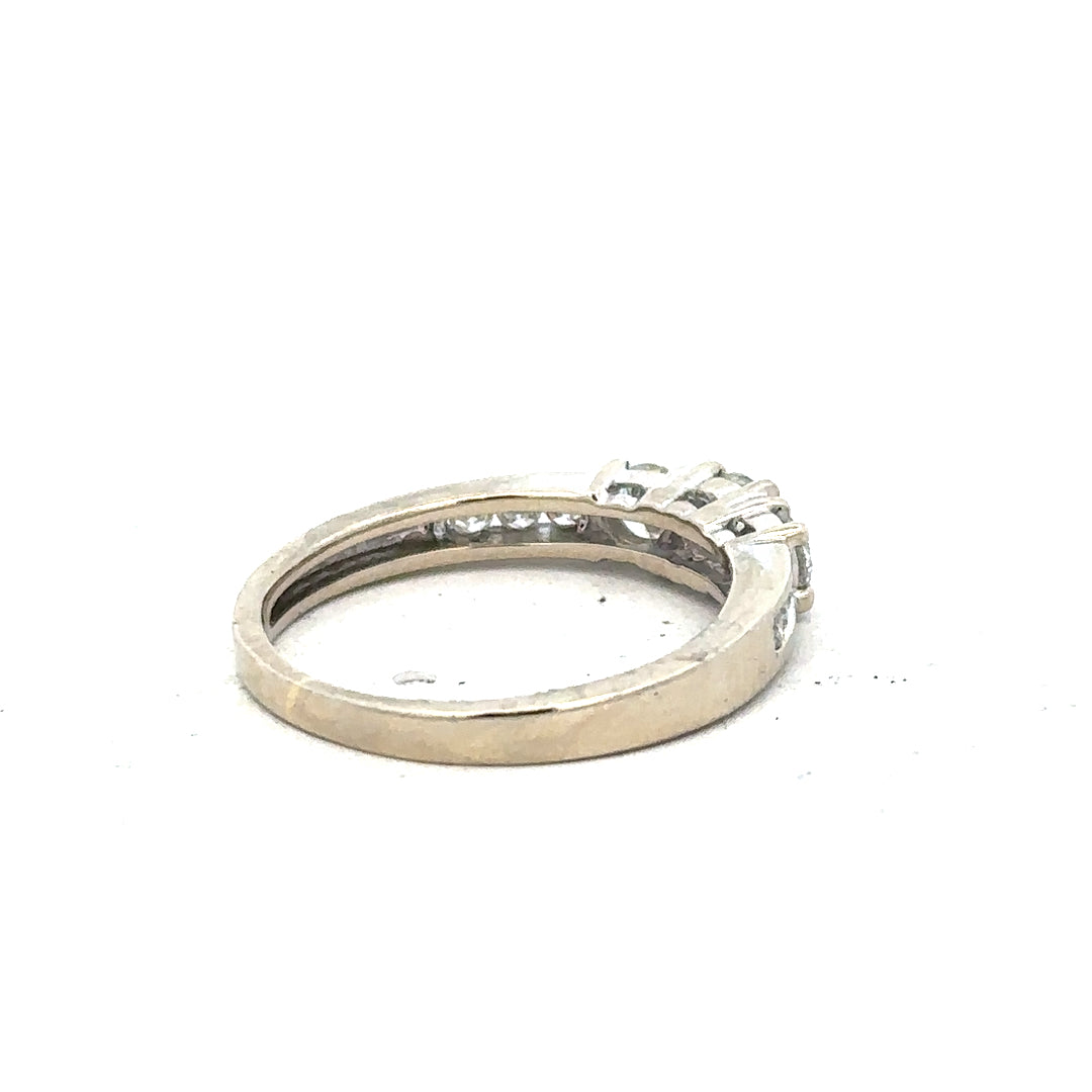 18ct white gold diamond ring in size L featuring sparkling diamonds and a sleek band design.