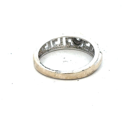 18ct white gold diamond ring in size N with sparkling diamonds, showcased on a neutral background.