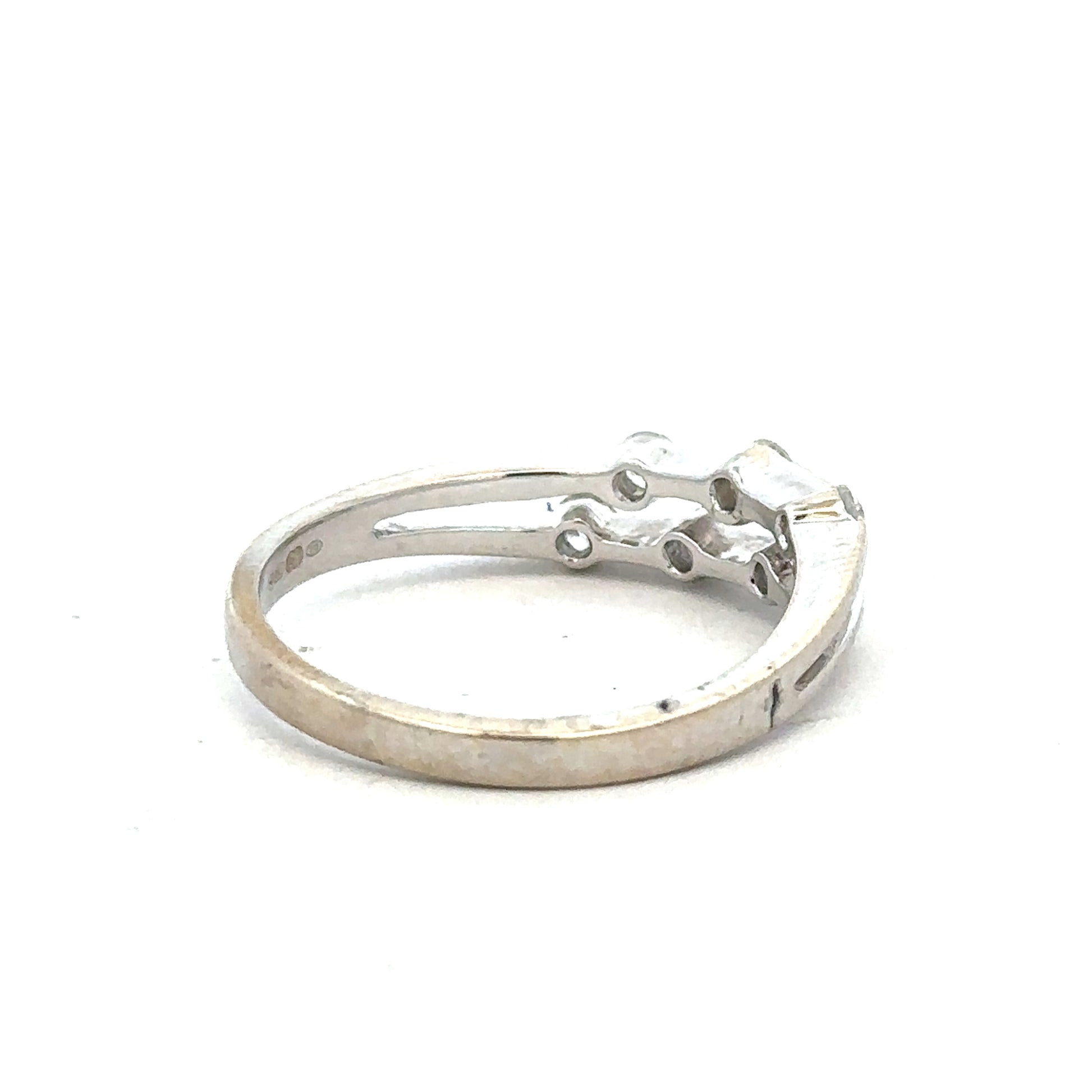 18ct white gold diamond ring in size O with a central diamond, showcasing elegant craftsmanship and sparkling brilliance.