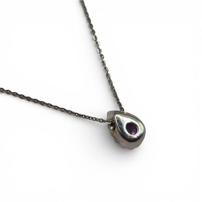18ct white gold pendant with pink sapphire and diamonds, showcasing a delicate design with sparkling gemstones.
