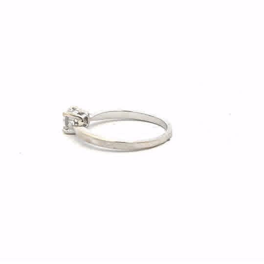 18ct white gold ring in size J1/2 with a smooth band, showcased on a plain background.